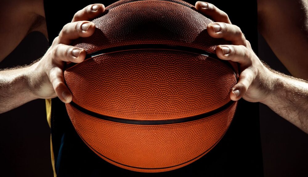 A man holding a basketball