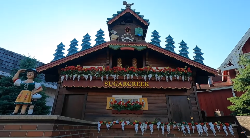 Sugarcreek building with flowers and figures on it
