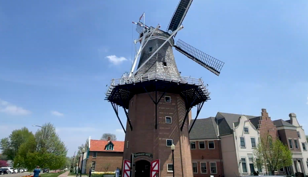 windmill in the town amidst the buildings