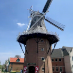 windmill in the town amidst the buildings