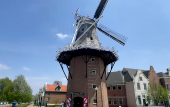 windmill in the town amidst the buildings