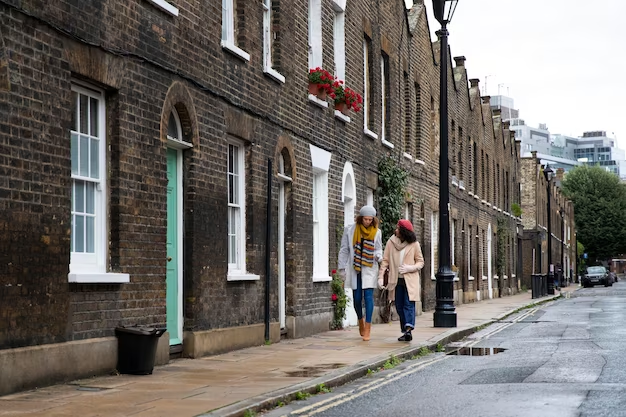 Two girls walking down the street