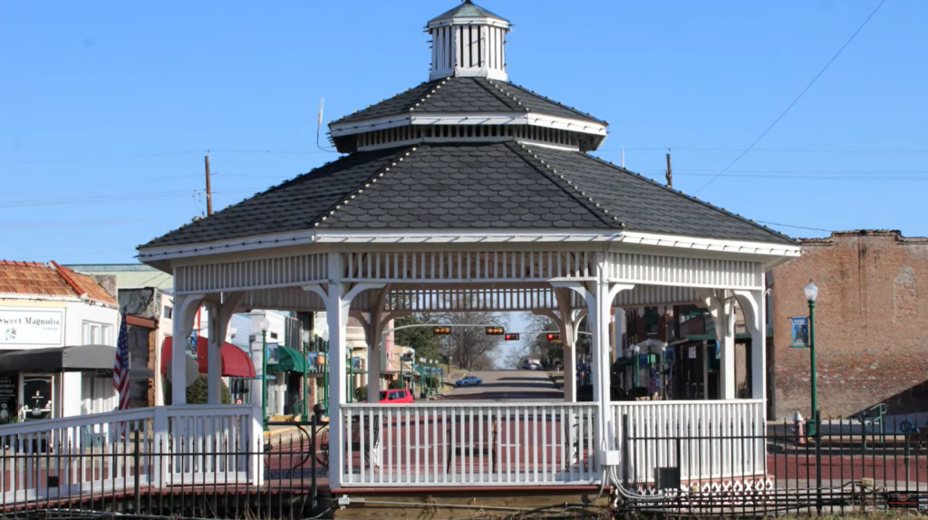 black and white gazebo on the middle of the street