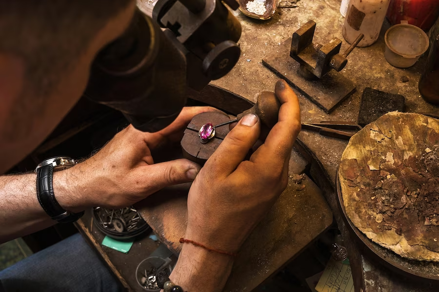 man crafting handmade jewelry